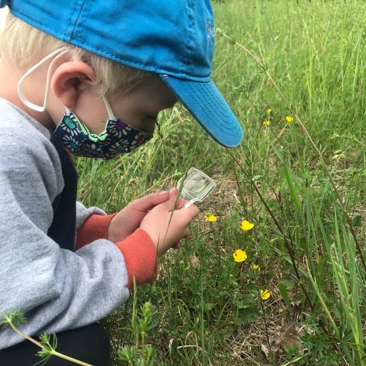 Young student exploring outside